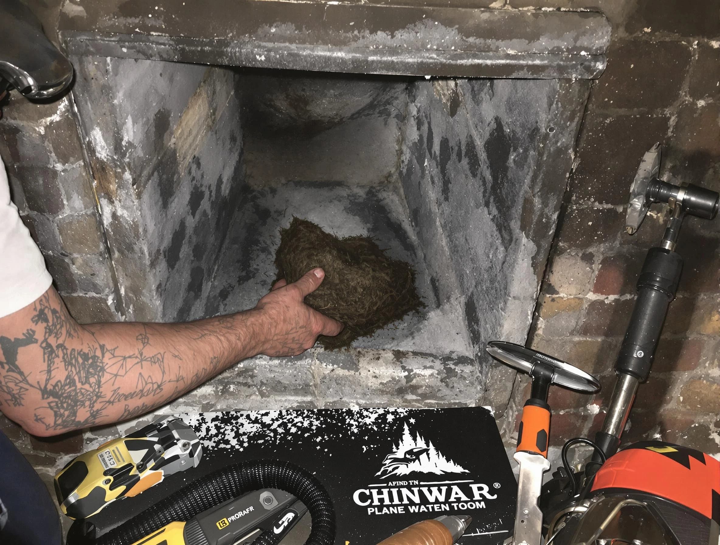Scottdale Chimney Sweep safely removing debris and screening chimney in Scottdale, GA